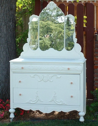 Moss green and peach country-style cabinet-top dresser; 1920s.